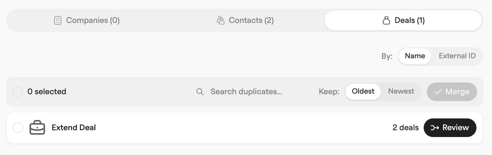 Duplicates Deals tab with a Name and External ID match switch and one duplicate group of two deals ready to review